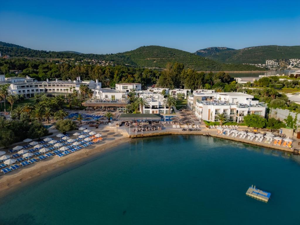 an aerial view of a resort with a large pool at Samara Hotel Bodrum in Torba