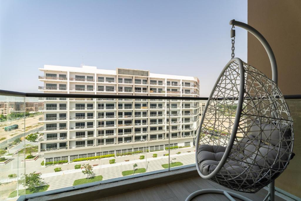a view of a large building from a balcony at Nasma Luxury Stays - Laya Heights in Dubai