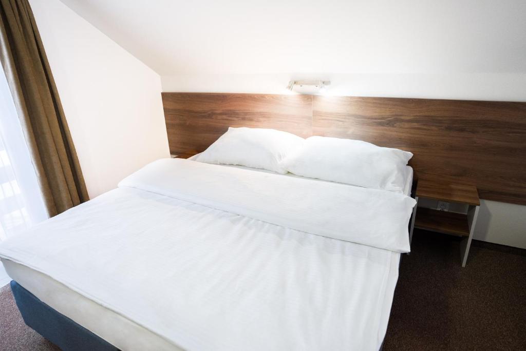 Postel nebo postele na pokoji v ubytování Apartmány Banff