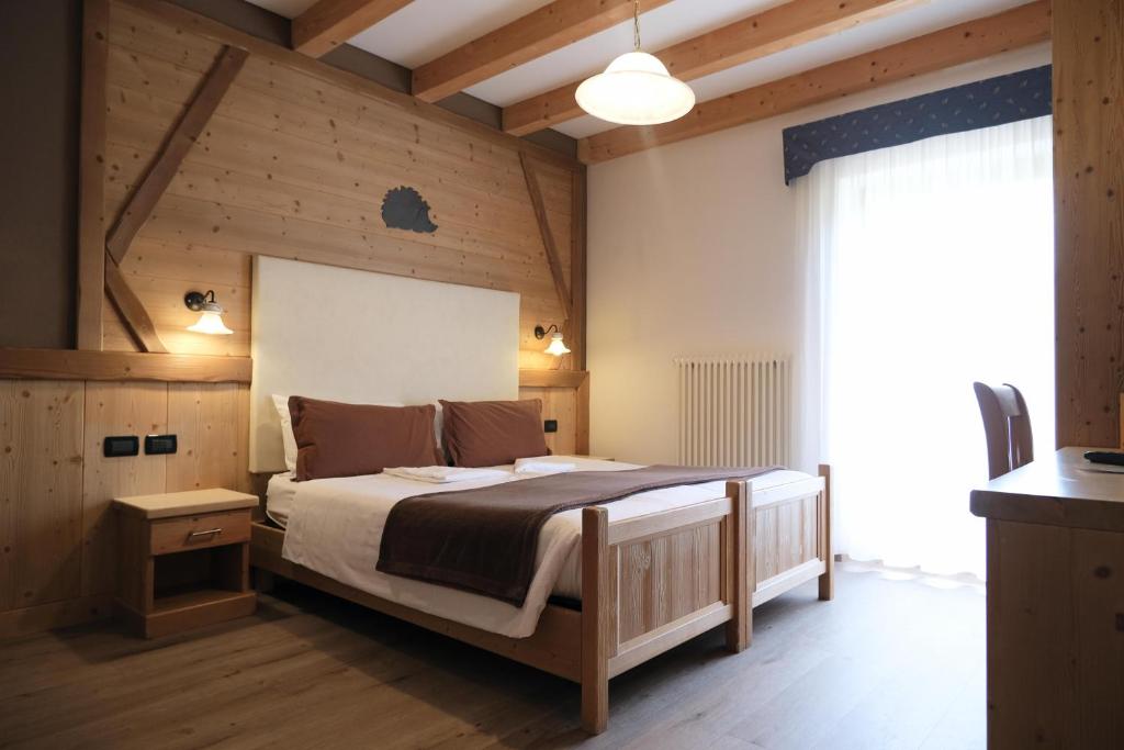 Postel nebo postele na pokoji v ubytování Flos Hotel