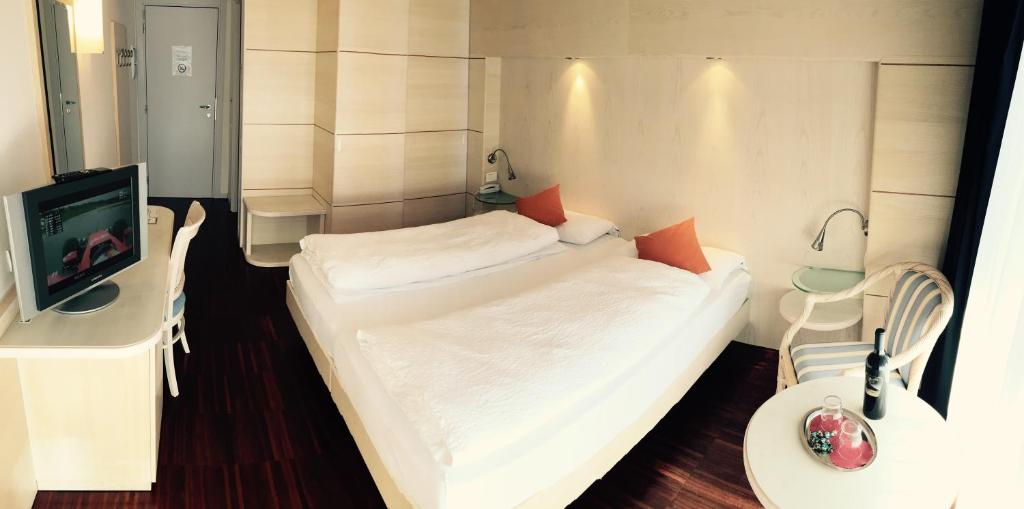 Postel nebo postele na pokoji v ubytování Park Hotel Il Vigneto