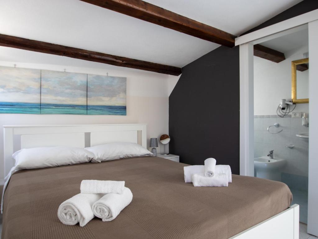 Postel nebo postele na pokoji v ubytování DUCEZIO rooms