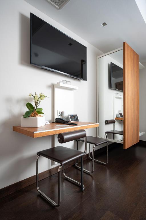 TV a/nebo společenská místnost v ubytování Best Western Plus Hotel De Capuleti
