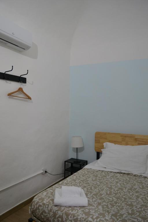 Posteľ alebo postele v izbe v ubytovaní Il Teatro Rooms