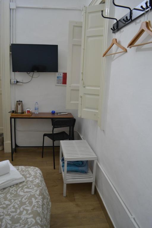 Posteľ alebo postele v izbe v ubytovaní Il Teatro Rooms
