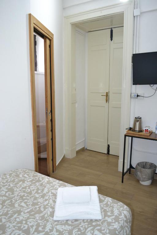 Posteľ alebo postele v izbe v ubytovaní Il Teatro Rooms