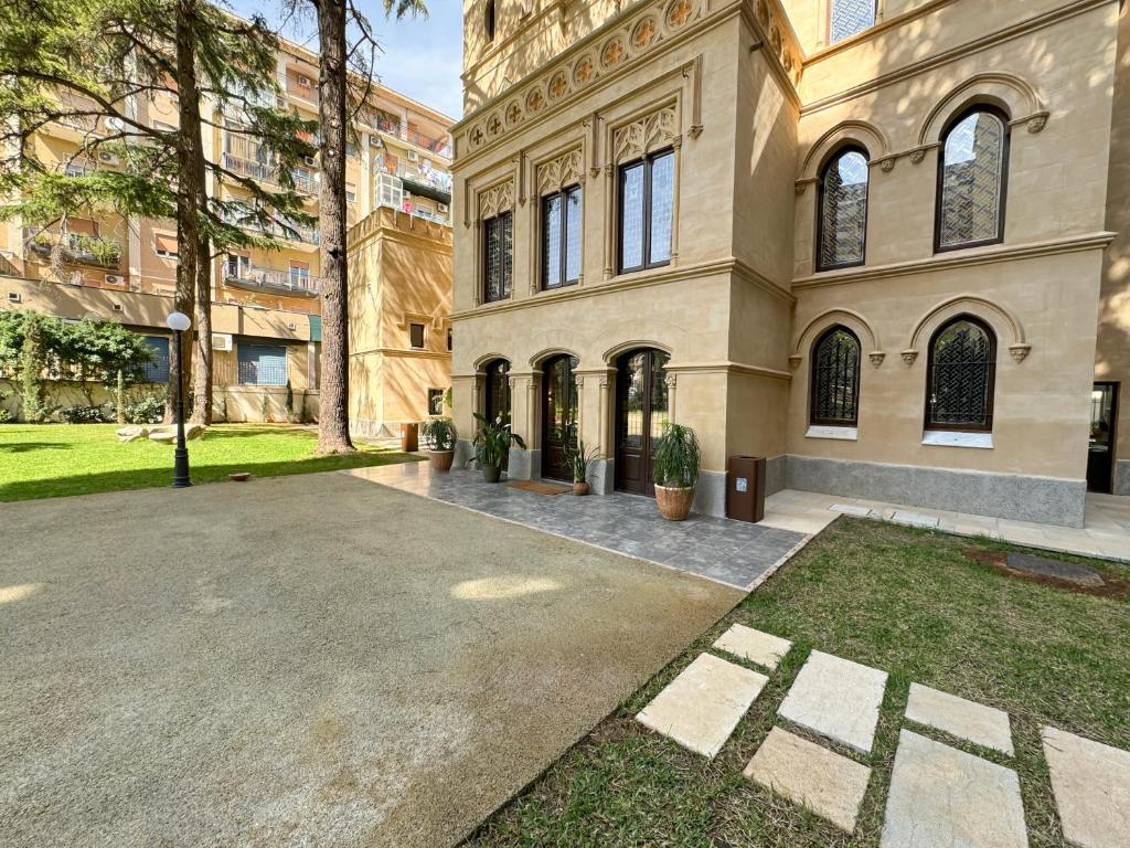 a large building with a courtyard in front of it at Villa Alliata di Pietratagliata in Palermo