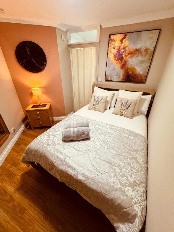a bedroom with a bed with a pillow on it at Garden Place in Clevedon