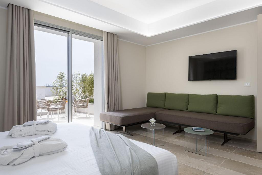 Postel nebo postele na pokoji v ubytování Torre Assunta Hotel