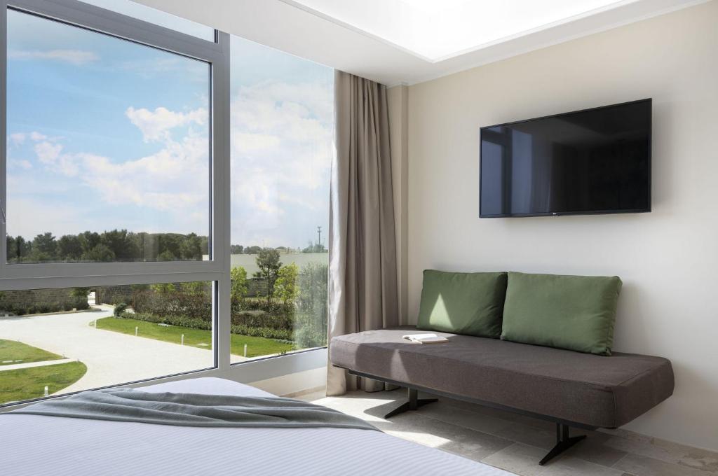 TV a/nebo společenská místnost v ubytování Torre Assunta Hotel