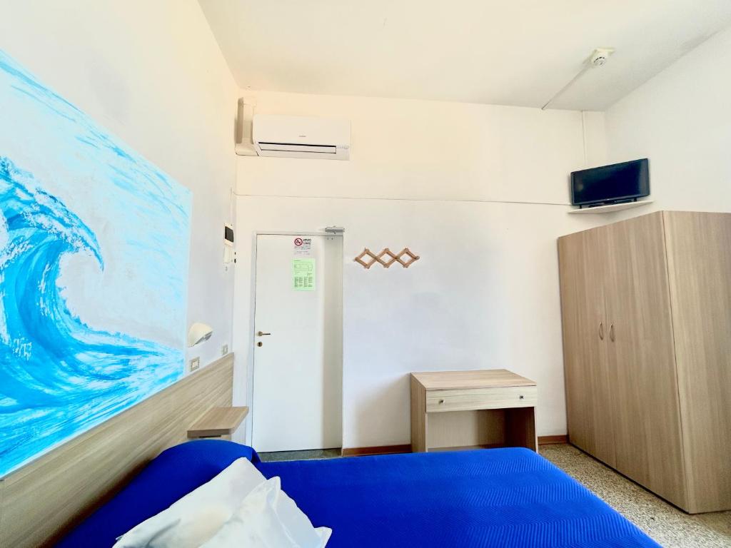 Postel nebo postele na pokoji v ubytování Hotel Bartolini