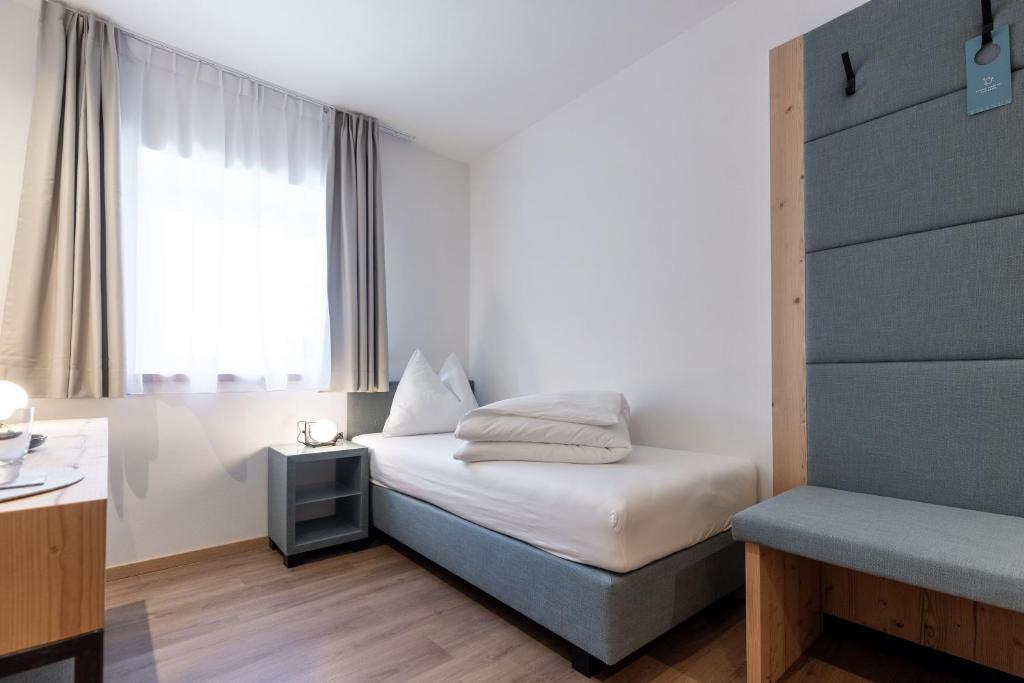 Postel nebo postele na pokoji v ubytování Hotel Alpenrose