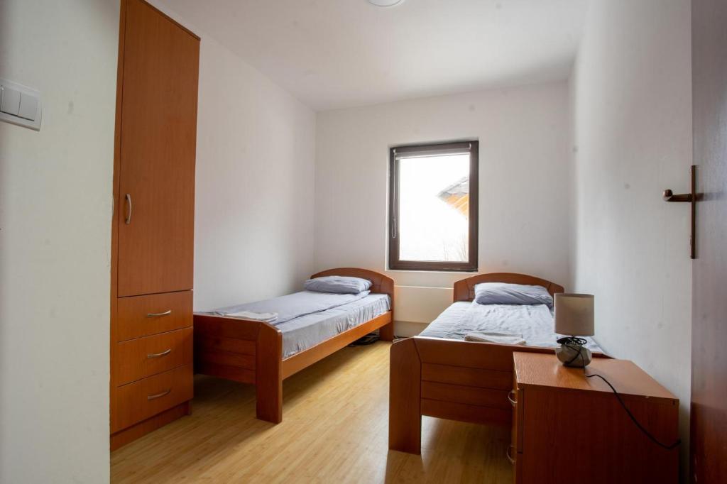 Una cama o camas en una habitación de Šumska kuća Divčibare