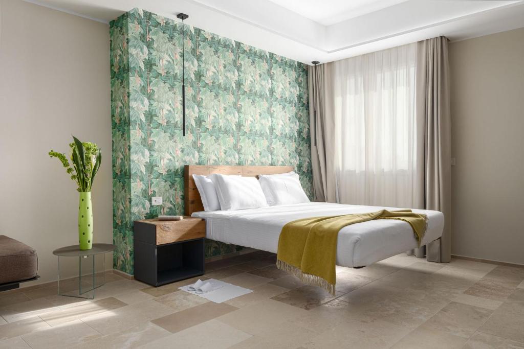 Postel nebo postele na pokoji v ubytování Torre Assunta Hotel