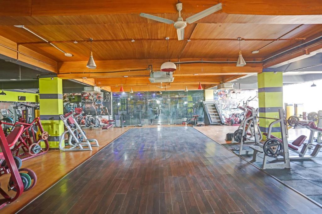 a gym with a bunch of exercise bikes in it at Collection O 80785 Hotel Shree Shyam in Rewāri