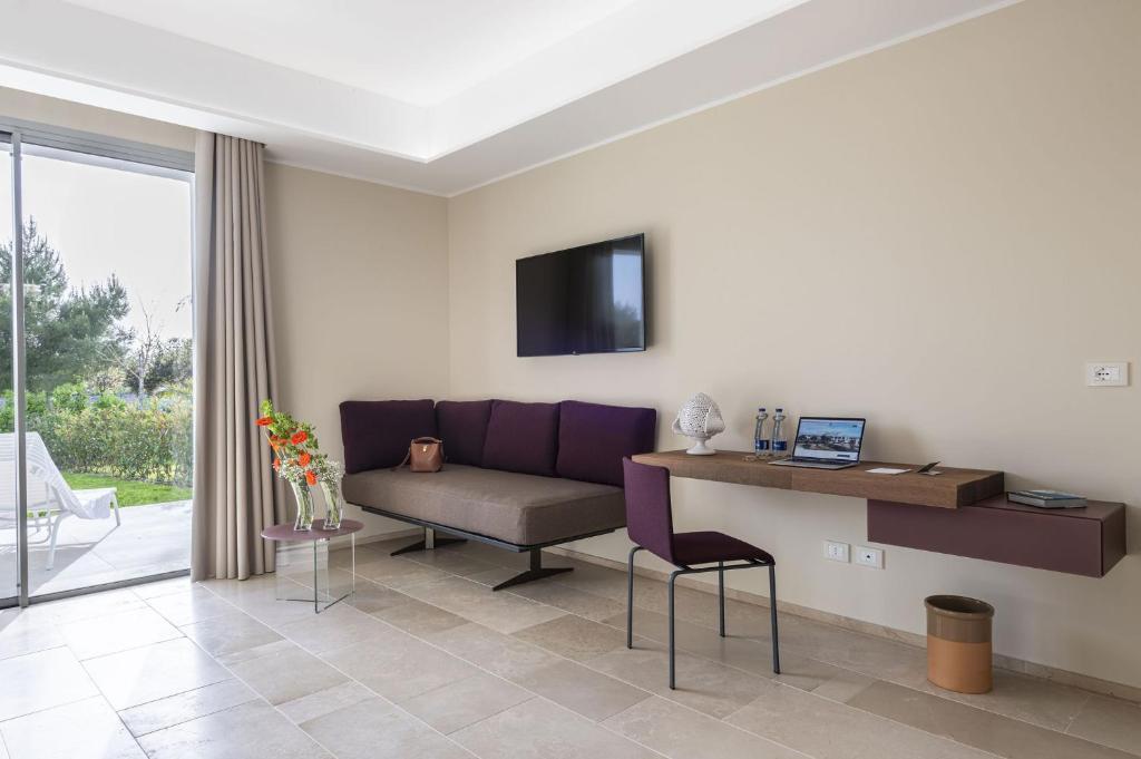TV a/nebo společenská místnost v ubytování Torre Assunta Hotel
