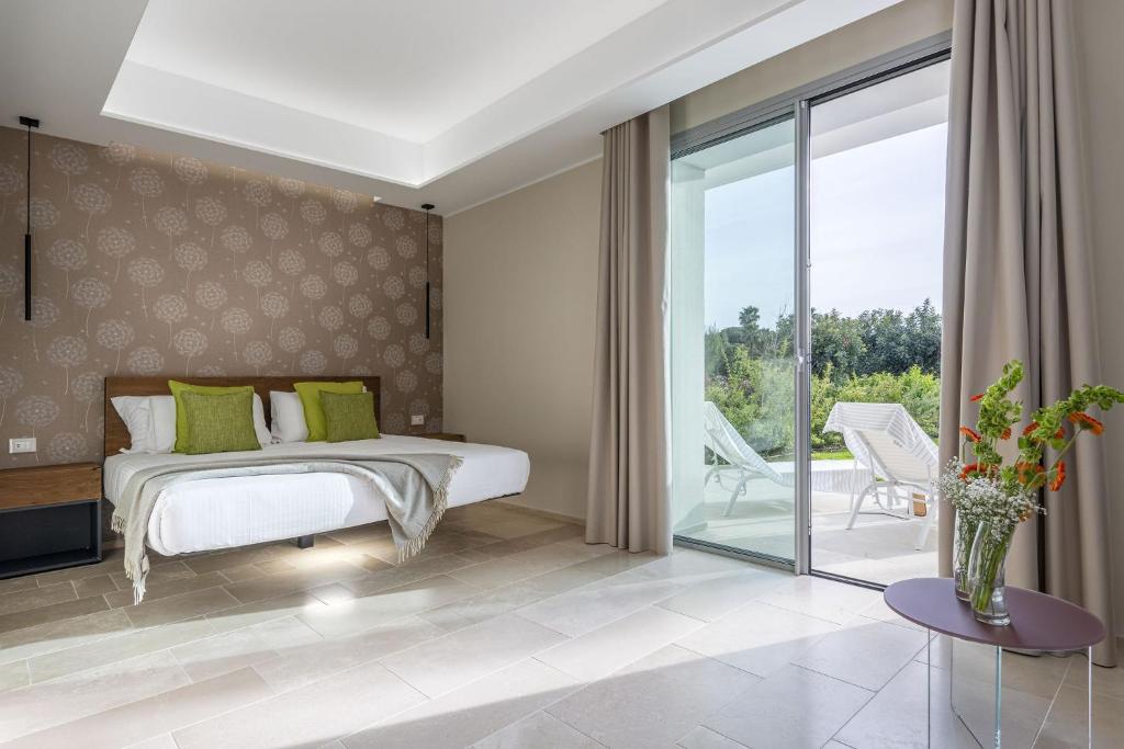 Postel nebo postele na pokoji v ubytování Torre Assunta Hotel