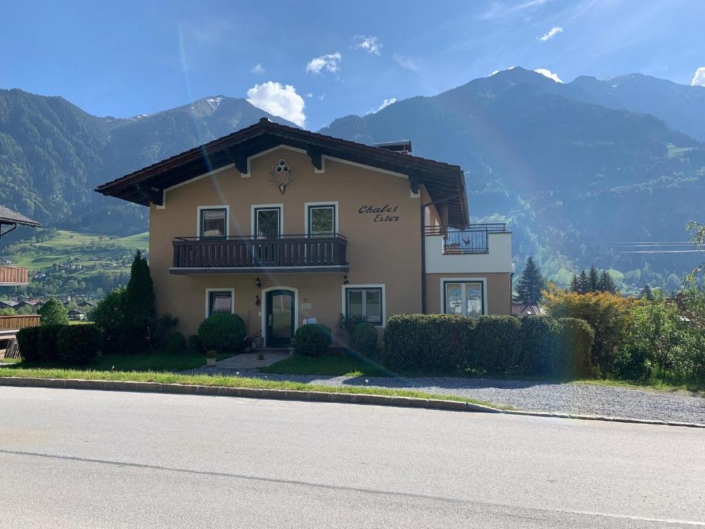 a house with a balcony on the side of a road at Chalet Ester in Bad Hofgastein