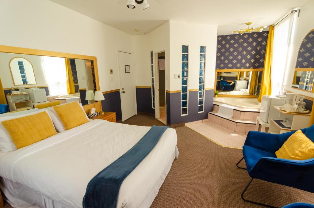 Postel nebo postele na pokoji v ubytování Hotel Dorion