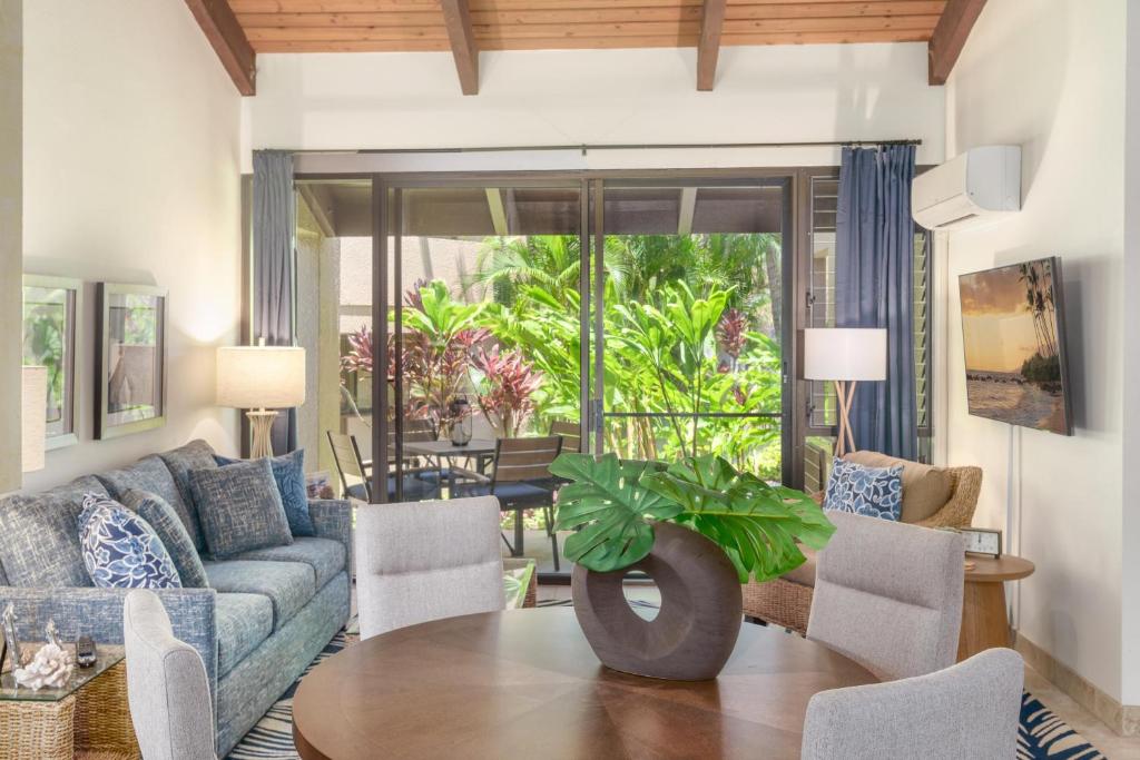a living room with a couch and a table at Kamaole Sands 7-100 in Wailea