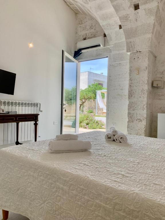 Postel nebo postele na pokoji v ubytování Corte Mercurio B&B