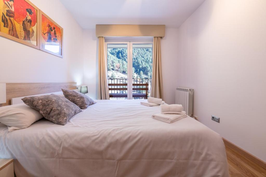 Postel nebo postele na pokoji v ubytování Apartamento EL RIU en Arinsal
