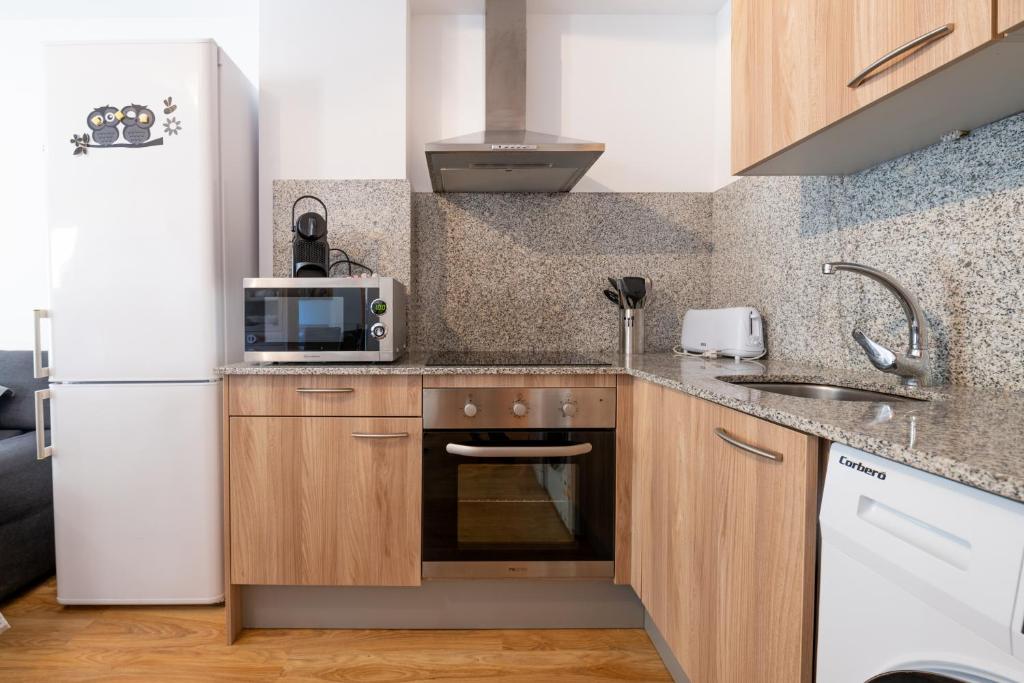 Kuchyň nebo kuchyňský kout v ubytování Apartamento EL RIU en Arinsal