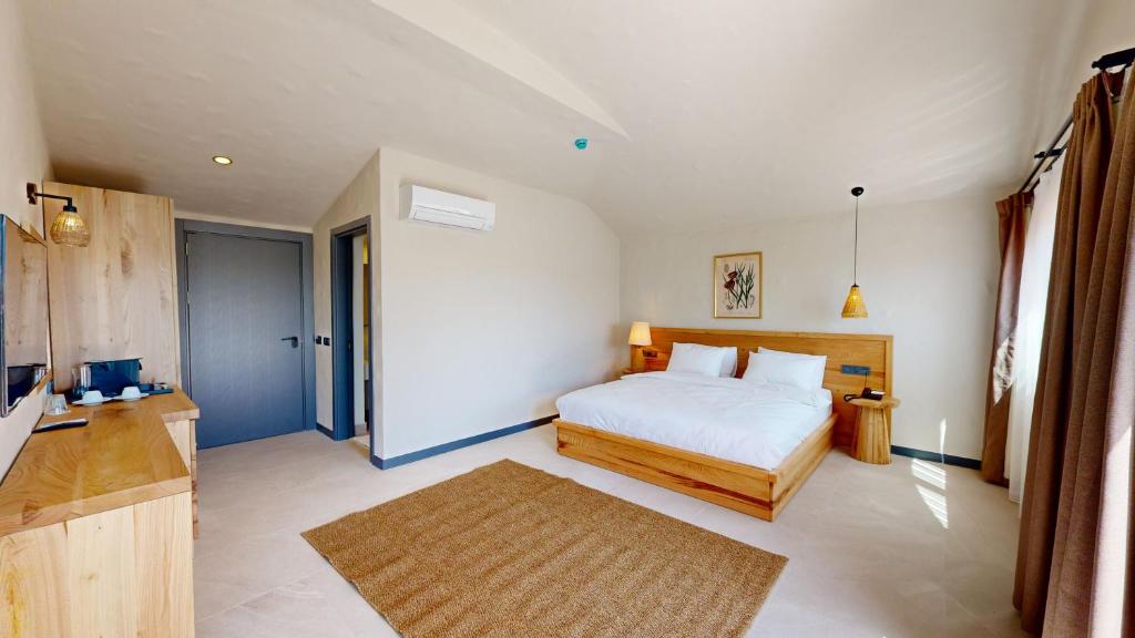 Postel nebo postele na pokoji v ubytování Unsal Hotel