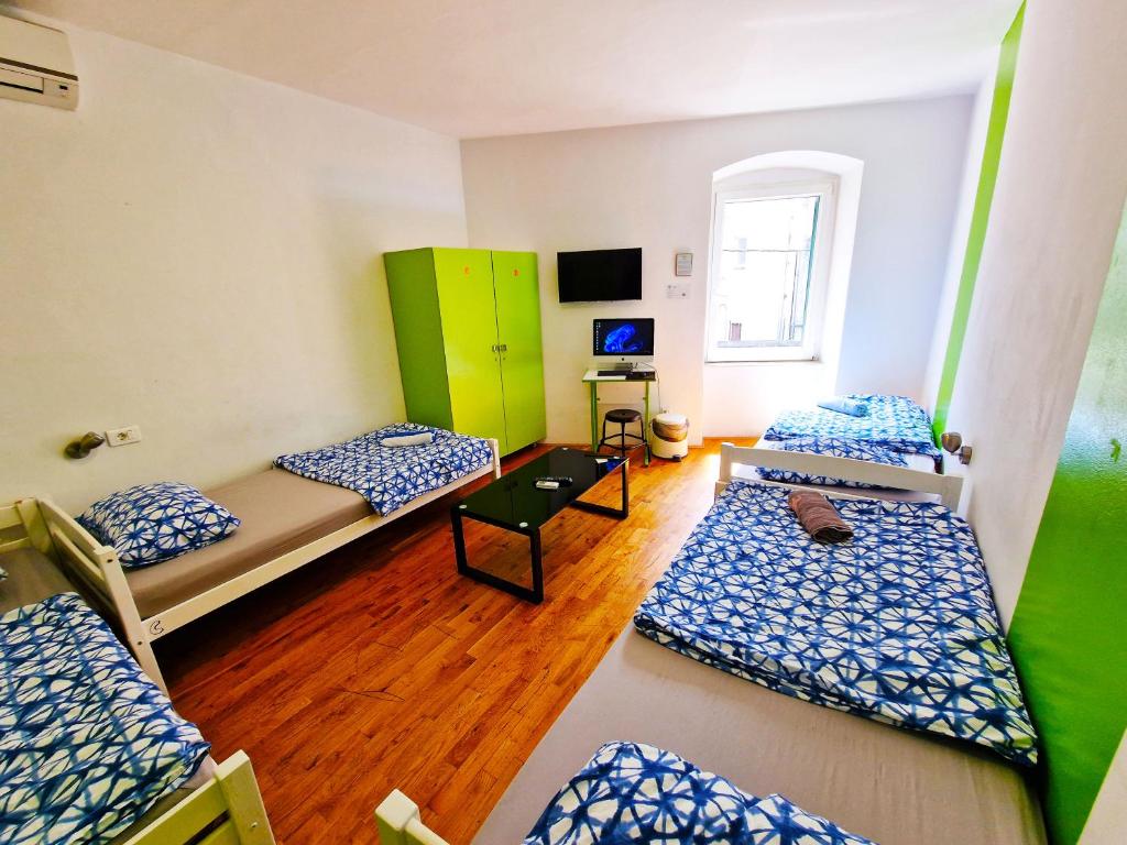 Postel nebo postele na pokoji v ubytování Croparadise Hostel