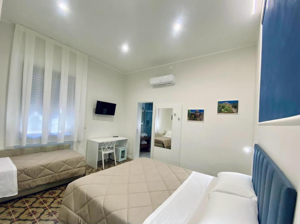 TV a/nebo společenská místnost v ubytování B&B Hèlios