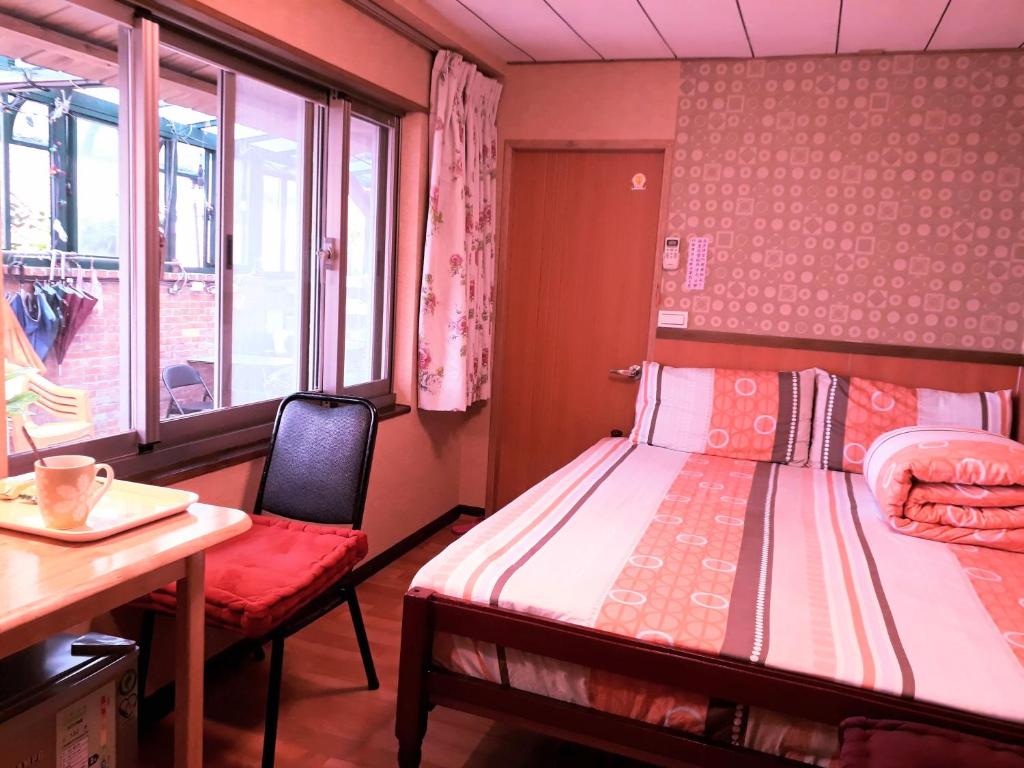 Postel nebo postele na pokoji v ubytování Yun Cheng Homestay