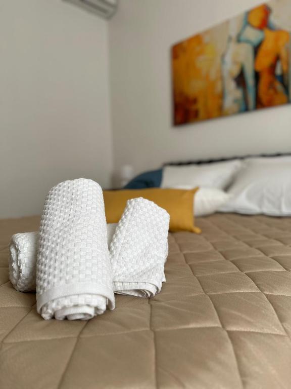 Postel nebo postele na pokoji v ubytování B&B L'ULIVO