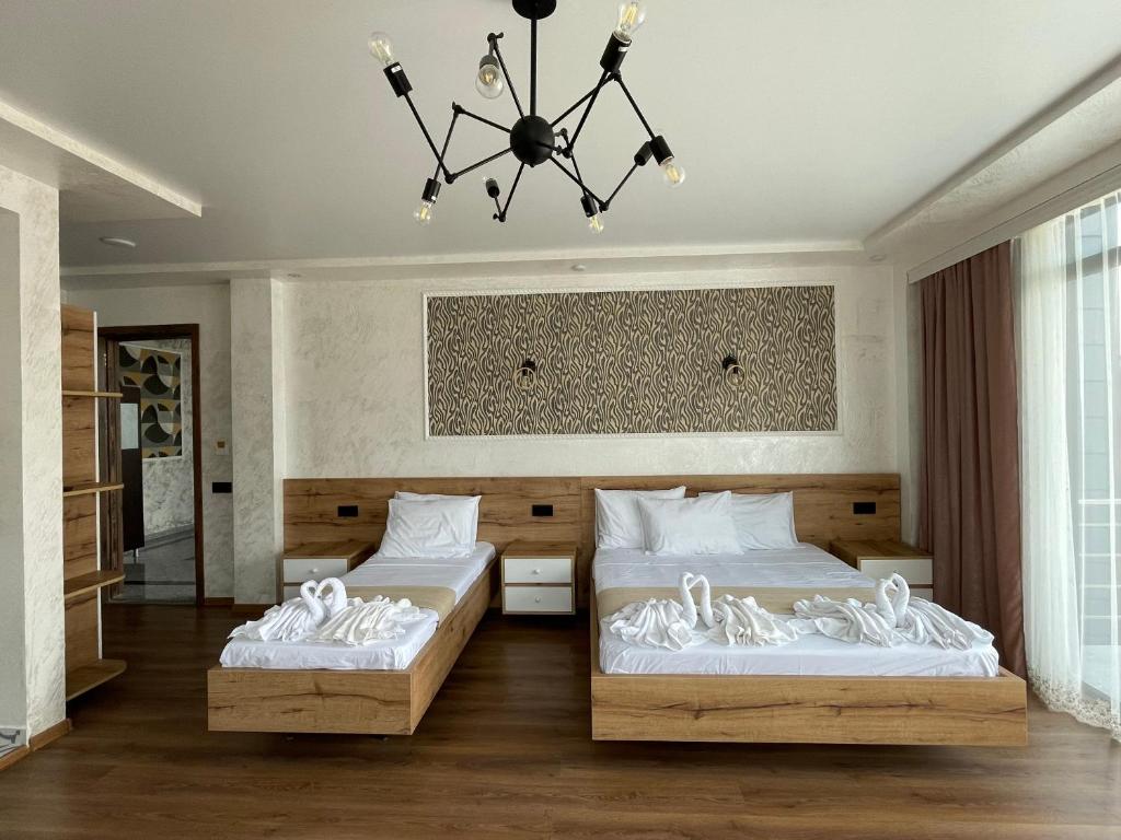 Postel nebo postele na pokoji v ubytování Hotel Sunlight