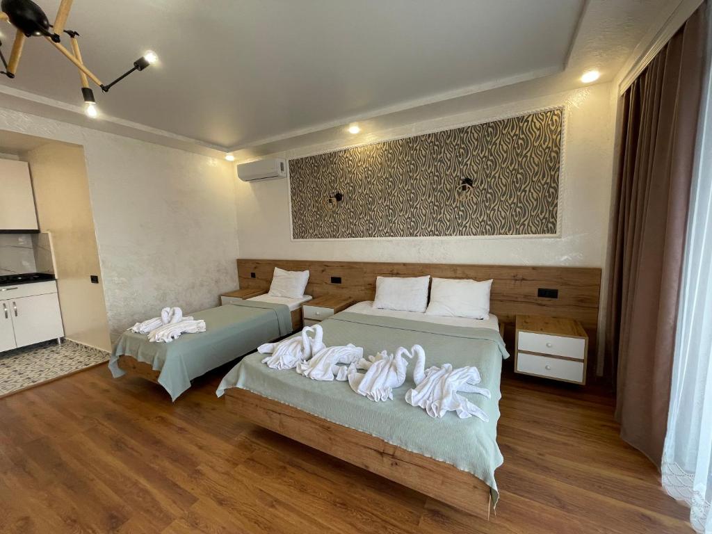 Postel nebo postele na pokoji v ubytování Hotel Sunlight
