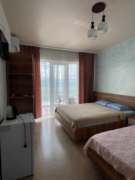 Postel nebo postele na pokoji v ubytování Hotel Sunlight