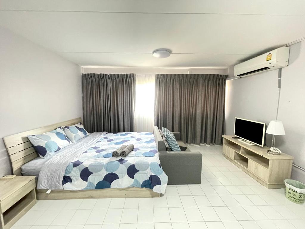 Ein Bett oder Betten in einem Zimmer der Unterkunft impact Condo C3 Milo