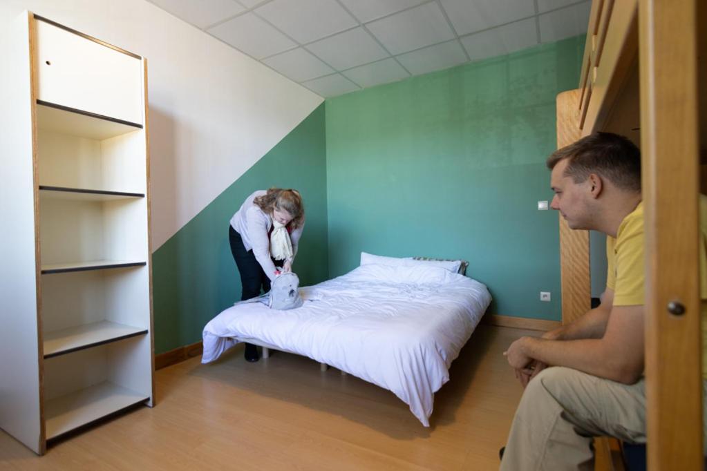 Postel nebo postele na pokoji v ubytování Gîte Kaleo Han-Sur-Lesse