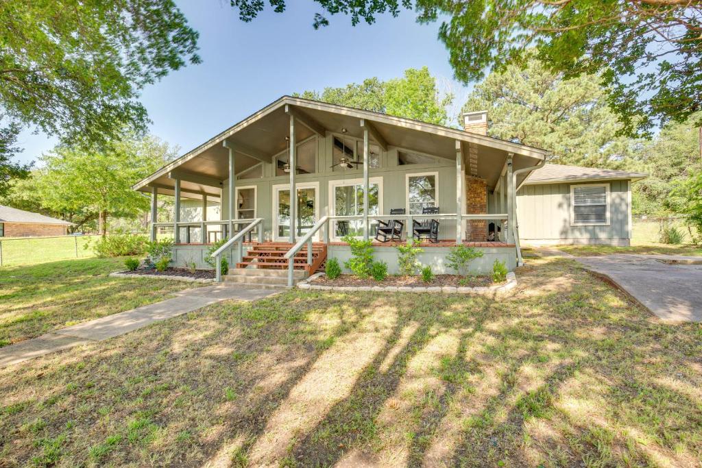 an image of a house with a porch at Private Dock and Fire Pit Cedar Creek Reservoir Gem in Gun Barrel City