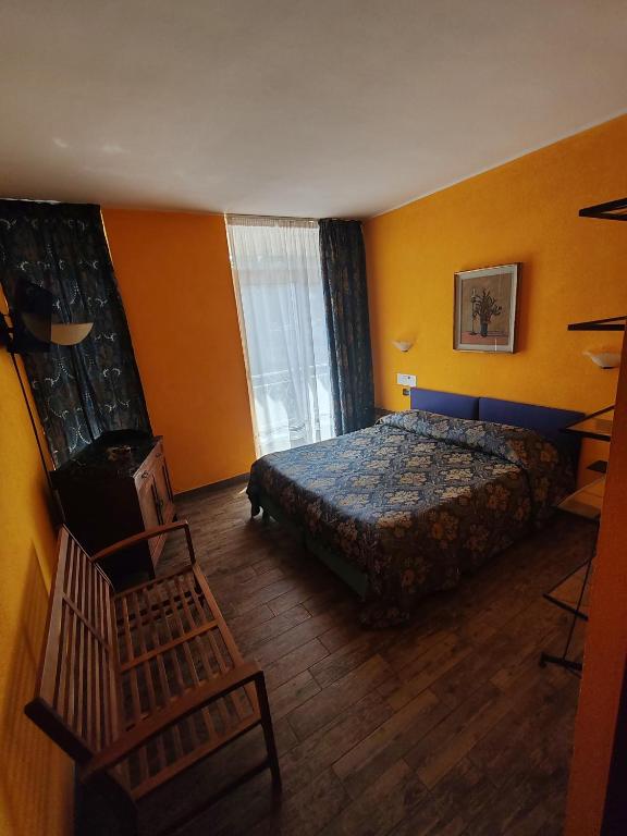 Postel nebo postele na pokoji v ubytování Hotel Panoramico SPA lago d'Orta