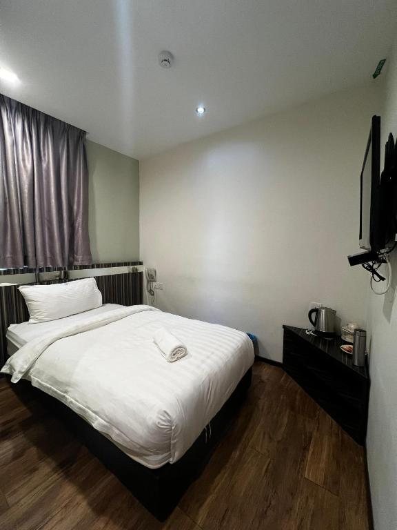 Postel nebo postele na pokoji v ubytování Kino Hotel