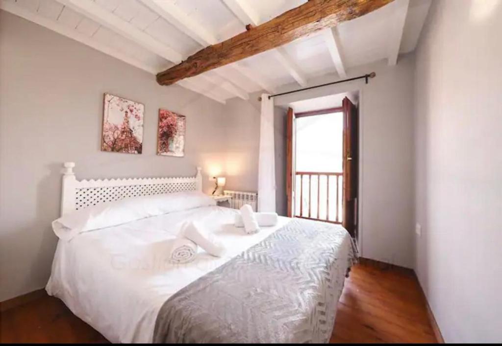 Postel nebo postele na pokoji v ubytování La Casina de la Peña