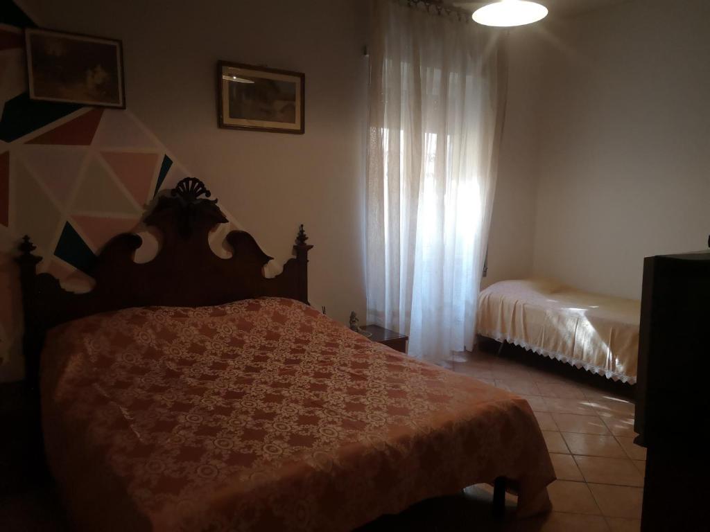 Postel nebo postele na pokoji v ubytování APE REGINA Rignano Gramsci