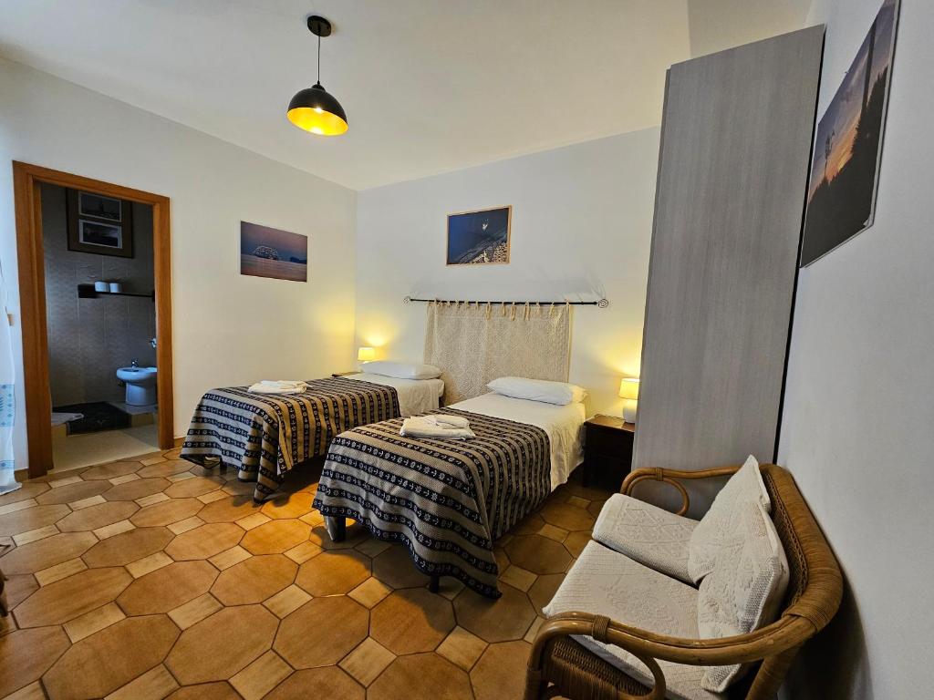 Postel nebo postele na pokoji v ubytování Antonhouse Alghero
