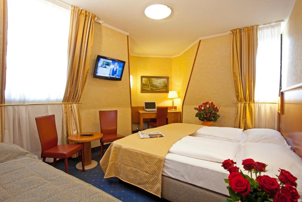 Katil atau katil-katil dalam bilik di Hotel Neue Post I self check-in