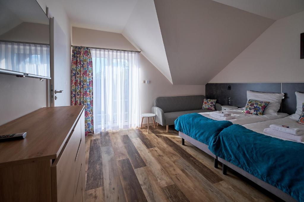 Postel nebo postele na pokoji v ubytování Dom Gościnny Wetlinn