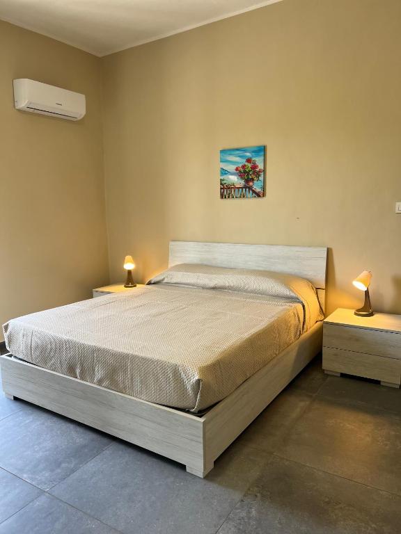 Postel nebo postele na pokoji v ubytování Appartamenti Minturnae Relais