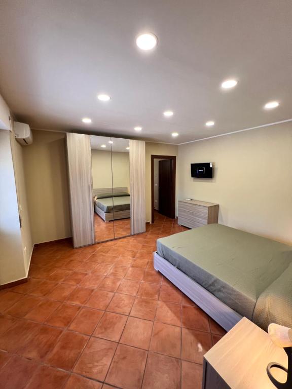 Postel nebo postele na pokoji v ubytování Appartamenti Minturnae Relais