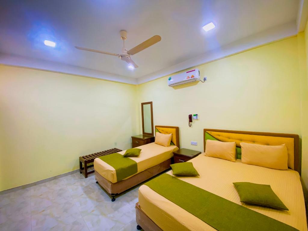 Postel nebo postele na pokoji v ubytování Sparkling Resort Kataragama
