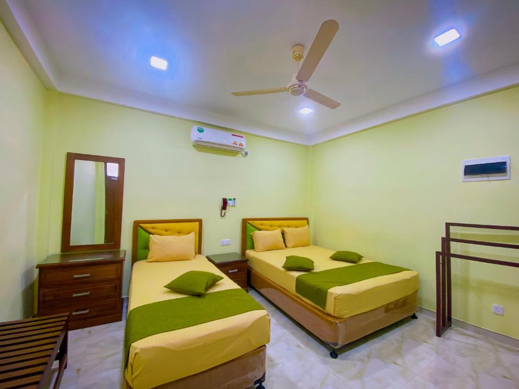 Postel nebo postele na pokoji v ubytování Sparkling Resort Kataragama