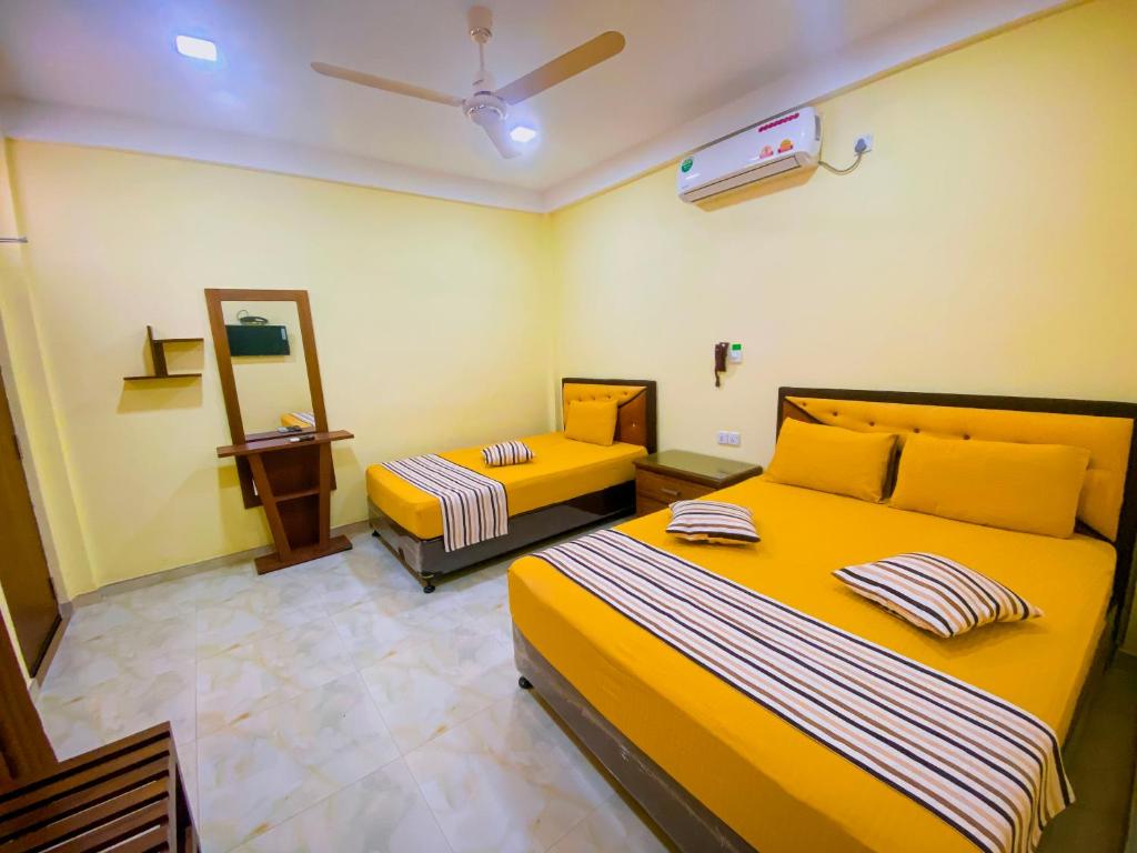 Postel nebo postele na pokoji v ubytování Sparkling Resort Kataragama